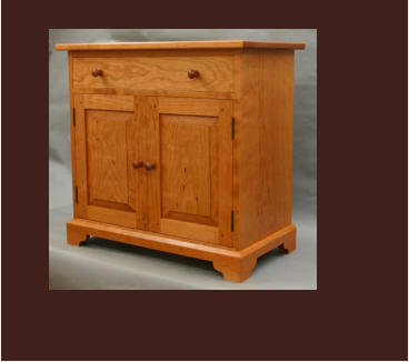handmade cherry cabinet with drawer and doors 
