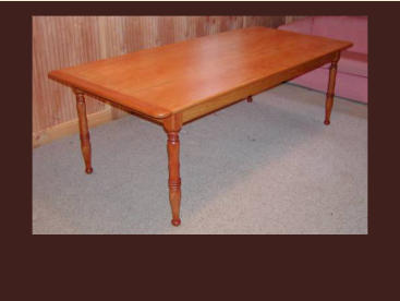 custom cherry dining table with turned legs and breadboard ends